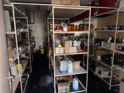a room filled with lots of shelves and containers