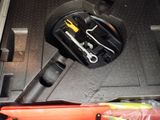 a tool in the trunk of a car with tools in it