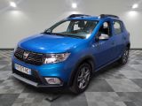 a picture of a blue dacia parked in a garage