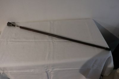 a white table with a white table cloth and a metal pole