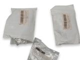 three bags of food sitting next to each other on a white surface