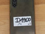 the back of a phone with a sticker on it sitting on a table