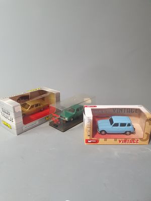 two toy cars that are in a box on the table
