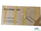 a cardboard box with a picture of a walking pad on it
