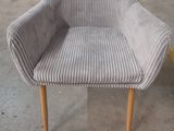 a chair that is sitting in the middle of a room