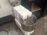 a machine that is sitting on the floor next to a sink
