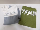 two t - shirts that are sitting on a table
