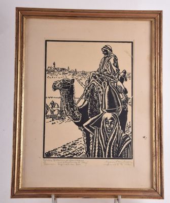 an image of a picture of a man riding a camel