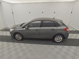 a picture of a grey car in a garage