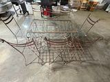 a glass table and four chairs in a room