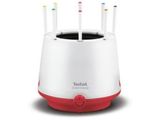 a close up of a white and red toothbrush holder