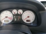 a close up of a car dashboard with a speedometer and gauges