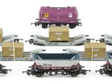 a lot of small toy trains that are on the tracks