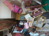 a pile of assorted items on the floor of a room