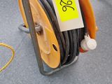 a hose that is sitting on the ground next to other hoses