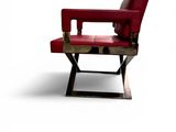 an image of a red chair sitting on top of a metal stand