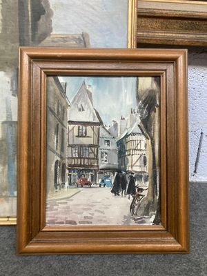 une photo d'un tableau représentant une scène de rue, dans un cadre