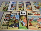 several children ' s books are lined up on a table