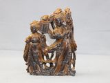 an antique bronze figurine of a man and woman with a basket