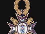 an image of a gold medal with a purple star on it