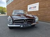 an image of a classic car parked in front of a building