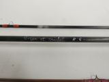 two different types of fishing rods on a white surface