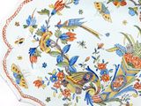 a large plate with a bird and flowers design on it