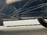 a close up view of a car ' s rear end with wires attached to it