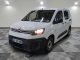 the white van is parked on a checkered floor in a room