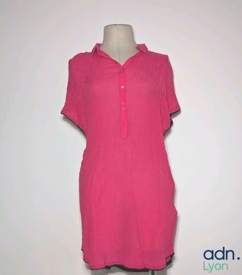 a picture of a pink dress on a mannequin stand