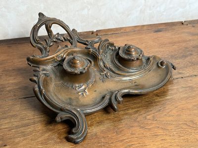 a metal object that is on a wooden table