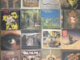 a lot of cds on the wall of this room