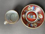 a cup and saucer sitting next to each other on a table