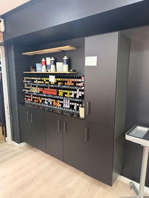 a wall of liquor bottles on the shelves in the store