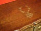 a wooden table with a clock on top of it