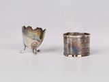 pair of silver plated napkin holders with a bird design