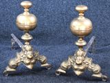 two candles that are sitting on a stand on a blue background