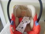 a baby car seat that is sitting on the floor