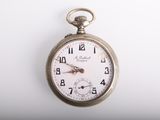 a silver pocket watch with a white face on a white surface