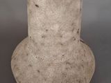 a black and white vase sitting on a table