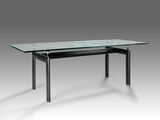 une photo d'une table en verre avec des pieds noirs et un plateau en verre