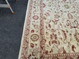 a rug on the ground next to a step ladder