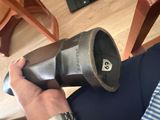 a person that is holding a hair dryer in their hand