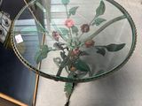 a glass table with flowers on it in a room