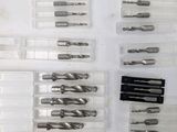 many different types of drill bits in a box