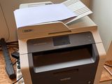 a printer that is sitting on top of a desk