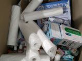 a cardboard box full of toilet paper and toilet paper rolls