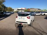 a white car that is parked in a parking lot