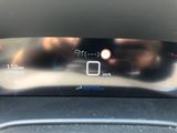 the dashboard of a car with a digital display on it