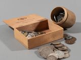 a small wooden box with coins in it